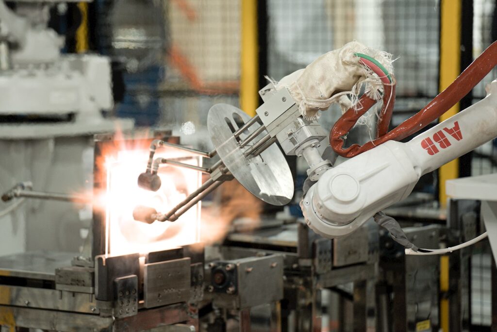 an ABB industrial robot arm helps manufacture quartz at a factory in Vietnam