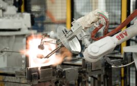 an ABB industrial robot arm helps manufacture quartz at a factory in Vietnam.