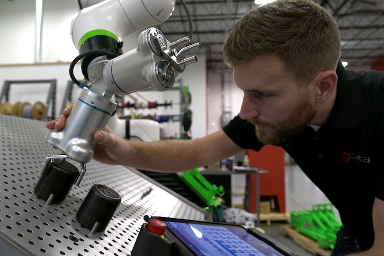 robotics integrator Acieta setting up a FANUC collaborative robot arm