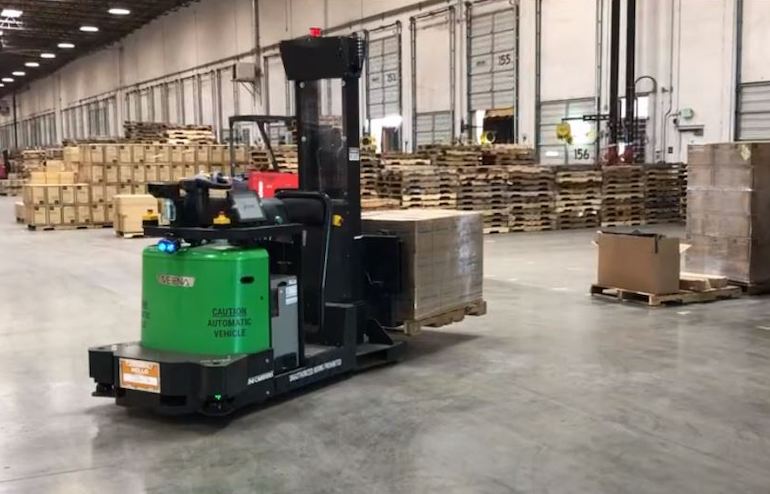 Automated forklift with full pallet load at Vecna's headquarters.