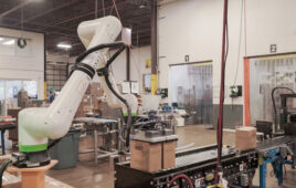 A Formic-branded cobot picking up two boxes from a conveyor belt.